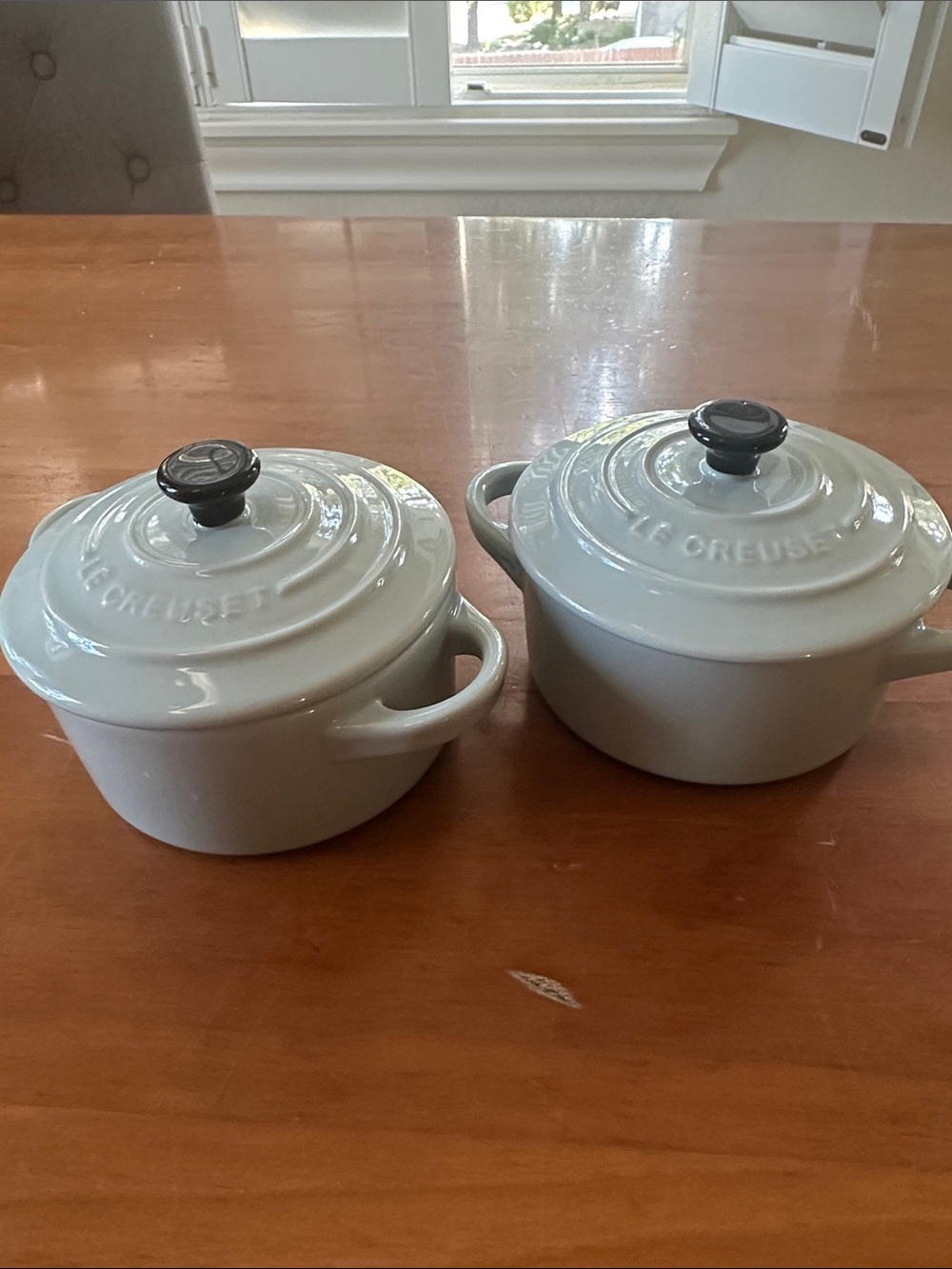 Le Creuset off-white / ivory Round Mini Cocotte Pair with Black Knobs